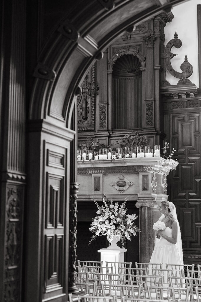 bride taking a moment before she walks down the aisle