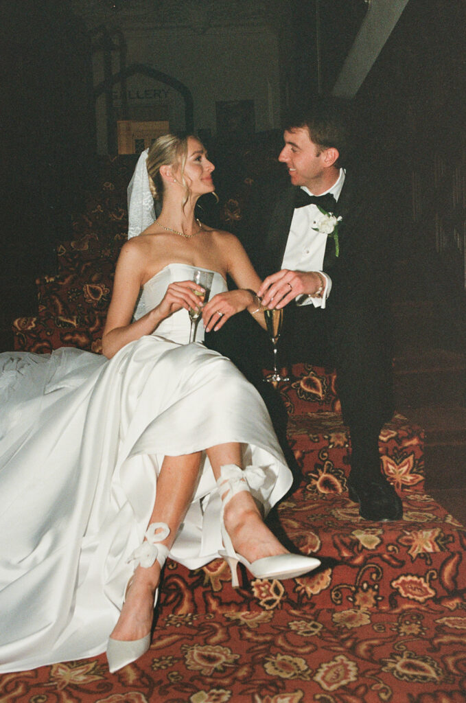 35mm film photo of bride and groom sitting down