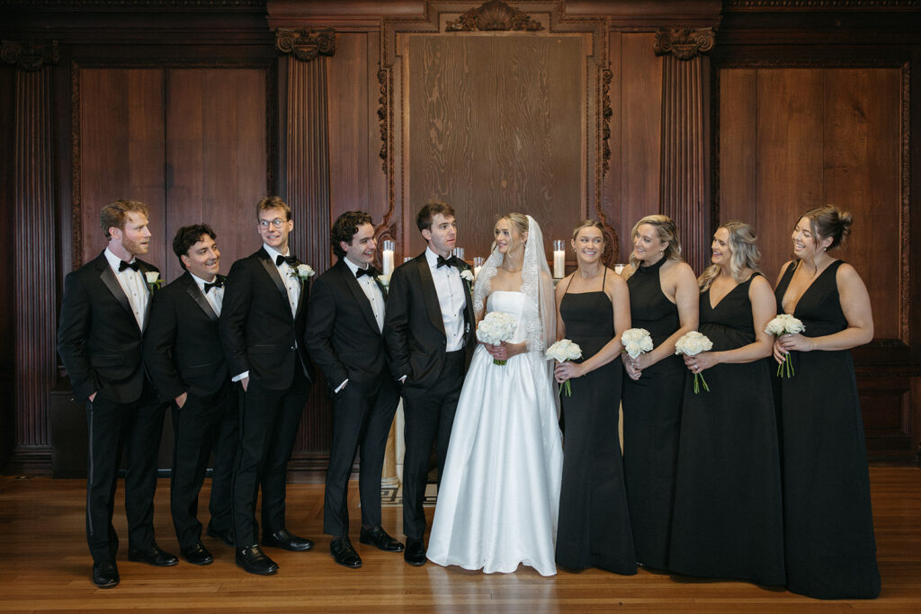 bride and groom with their wedding party