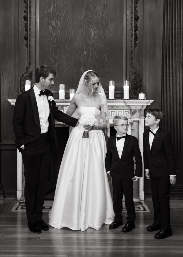 bride and groom with their nephews and ring bearers