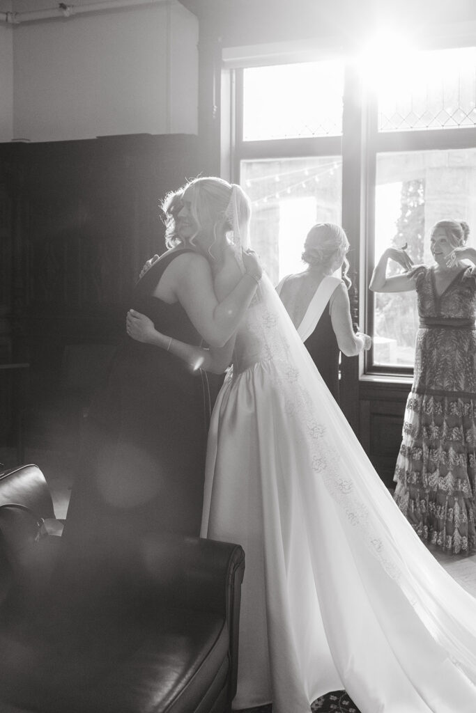 bride hugging her sister before the ceremony