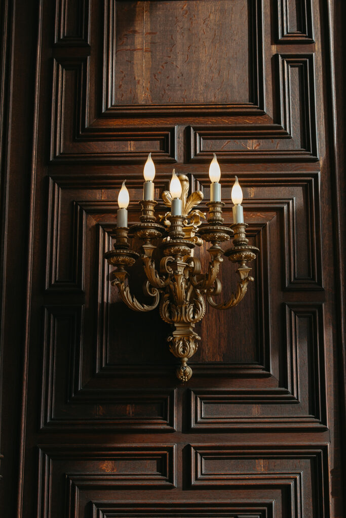 candle lights across the venue on dark wood