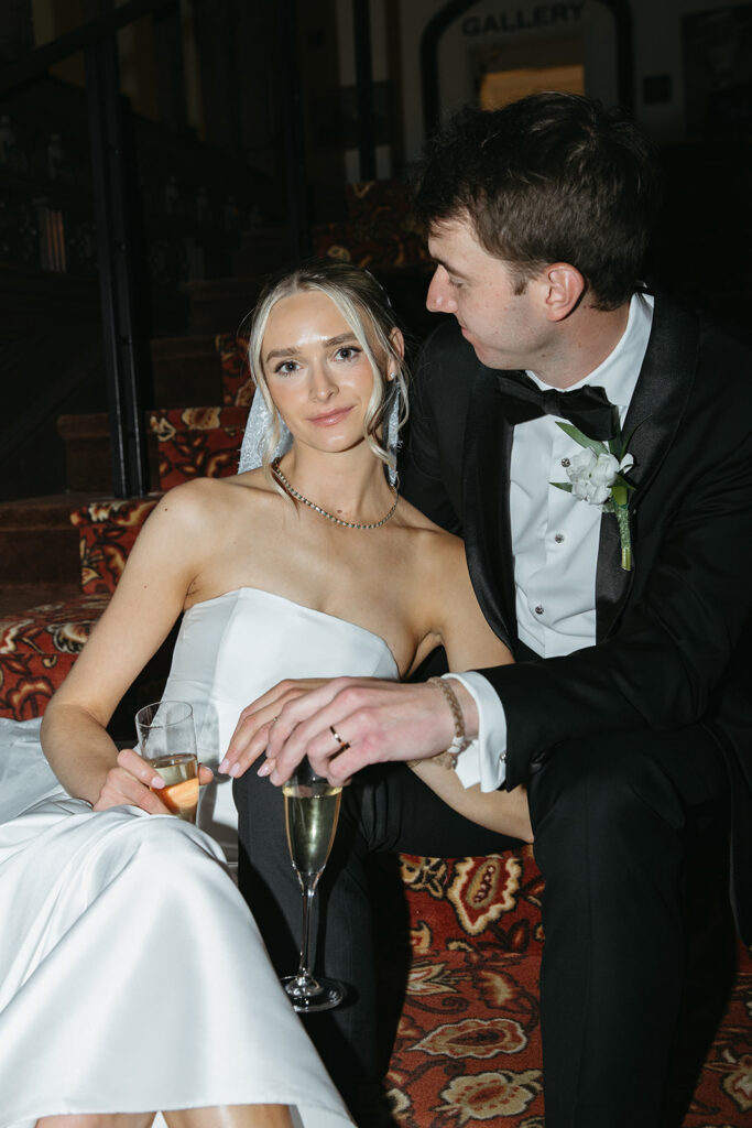 portrait of bride and groom sitting down