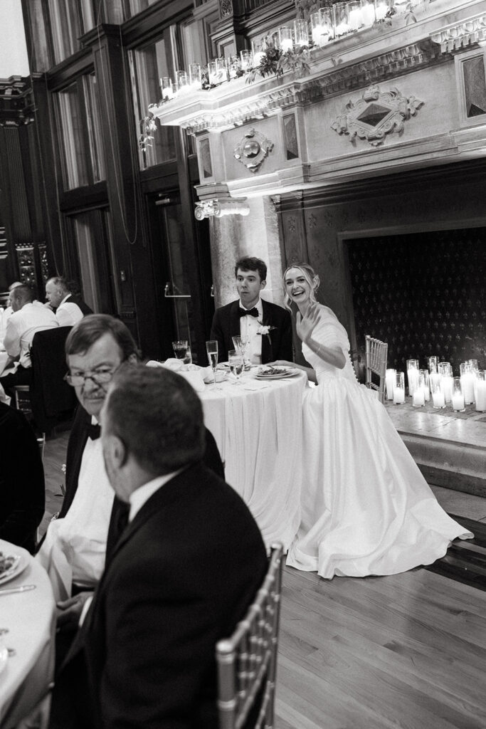 bride and groom in front of the fireplace at Branford House before they eat dinner