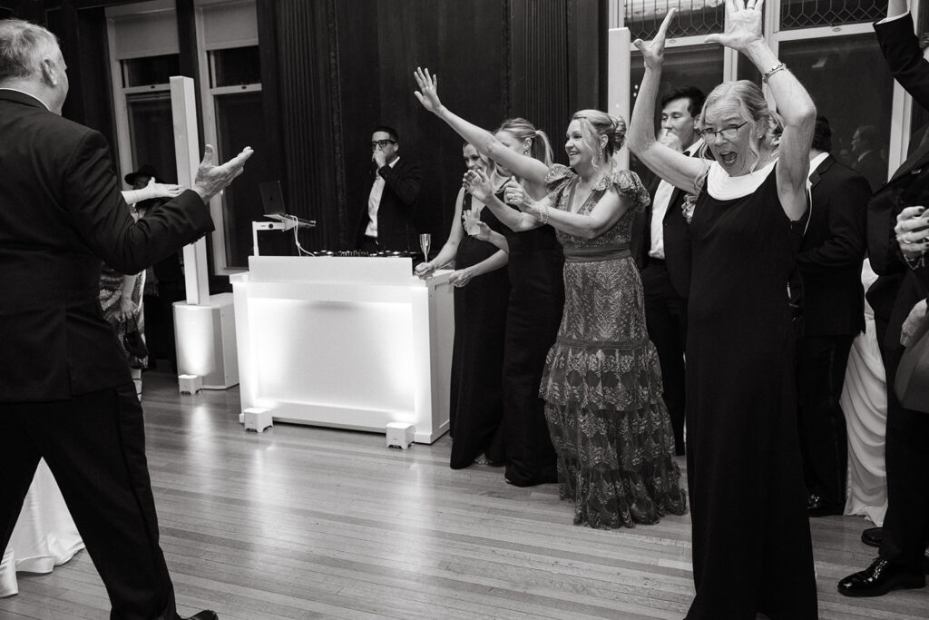family walking onto the dance floor to celebrate the bride and groom