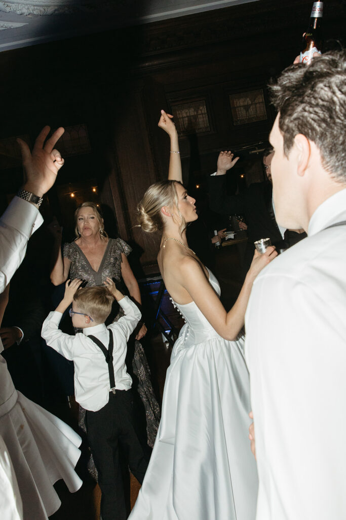 bride dancing with guests at her